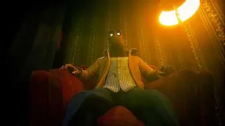 The masked man in Clickolding, photographed from a low angle