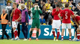 Denmark players in tears on the field after Christian Eriksen had collapsed.