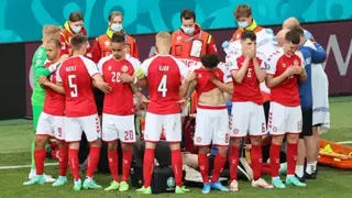 Reuters Players from Denmark form a collective ring to shield their teammate Christian Eriksen as he receives medical assistance during the UEFA EURO 2020 Group B match between Denmark and Finland in Copenhagen, Denmark, on 12 June 2021.
