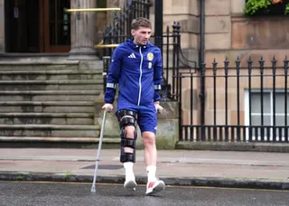 Billy Gilmour on crutches after his injury against Curaçao