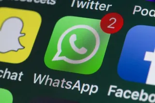 App icons for WhatsApp, Facebook, and Snapchat on an iPhone screen