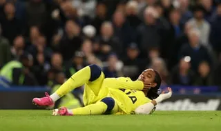Djed Spenc holds his jaw after a clash with Liam Delap in May