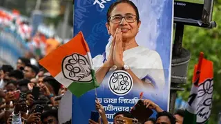 Supporters of the All India Trinamool Congress party attend a rally of Chief Minister of West Bengal Mamata Banerjee ahead of the second phase of the legislative assembly elections in Kolkata on April 27, 2026. (Photo by Dibyangshu SARKAR / AFP via Getty Images)