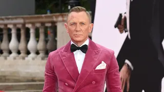 Actor Daniel Craig wearing a pink coat