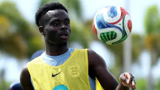 Bukayo Saka tosses a football in the air during an England training session in Florida
