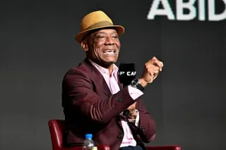 Former Cameroon goalkeeper Joseph-Antoine Bell speaks into a microphone