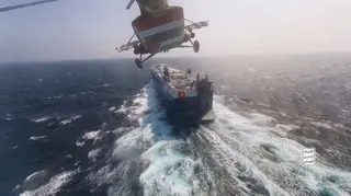Houthi military helicopter flies over the Galaxy Leader cargo ship in the Red Sea in this photo released November 20, 2023. — Houthi Military Media handout pic via Reuters