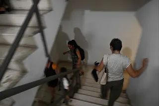 Workers rush down down a stairwell in Havana following a rare 6.1-magnitude earthquake that struck off the coast of Cuba on Monday. Photo: AFP