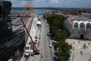 an aerial view of a city streets by the water