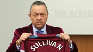 PA Media West Ham co-owner David Sullivan is holding a maroon shirt featuring his name, in a photograph dated 19 January 2010.