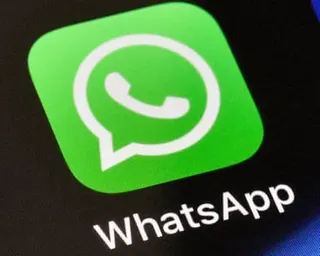 WhatsApp logo on a phone screen