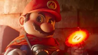 Mario holds a Fire Flower in his left hand in a still from The Super Mario Galaxy Movie