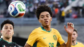 Herrington (right) beats Mexico's Jorge Sanchez to the ball during Australia's friendly at the Rose Bowl in California at the end of May. Mexico won the game 1-0