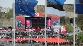Russian artists perform during a concert celebrating the 81st anniversary of the 1945 victory over Nazi Germany, at a fortress in Ivangorod, Russia, photographed from across the river in Narva, Estonia, on the Russian-Estonian border, on Saturday, May 9, 2026. (AP Photo/Sergei Grits)