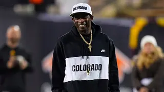 Colorado Buffaloes head coach Deion Sanders standing on the sidelines at Folsom Field.