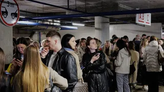 People take shelter in an underground car park during an air raid alert in Vilnius, Lithuania, Wednesday, May 20, 2026. (Vygintas Skaraitis/Lrytas via AP)