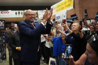 Ford clapping his hands towards crowds of supporters