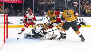 Jordan Staal scoring a goal against Carter Hart during a hockey game at T-Mobile Arena