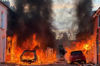 Vehicles set on fire by protesters burn on Lendrick Street in east Belfast, Northern Ireland, on Tuesday. Photo: AP