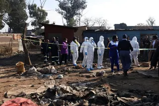 Forensics teams at the scene after the shootings. Photo: Reuters