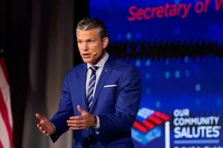 a man in a suit speaks