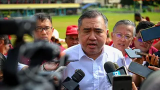 Transport Minister Anthony Loke responds to questions from reporters during the launch of the Lobak electronic screen today. PIC BY BERNAMA