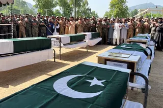 Pakistani Army officers and people offer prayers as they attend the funeral of the victims, who died after an Mi-17 helicopter of Pakistan Army Aviation crashed near Muzaffarabad on Wednesday during take-off, in Muzaffarabad, Pakistani Kashmir, June 11, 2026. Picture taken with a mobile phone. REUTERS/Naseer ud Din TPX IMAGES OF THE DAY