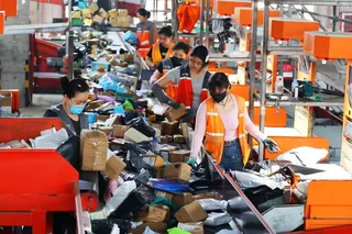 Workers sort express packages at a distribution centre in Lianyungang in China's Jiangsu Province. The express delivery industry is ramping up operations ahead of the  '618' online shopping festival. Photo: Getty Image