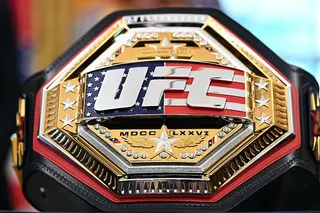 A UFC belt with an embedded American flag
