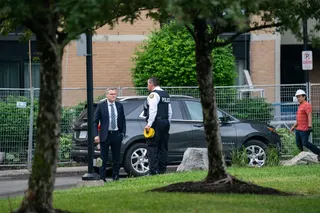 Investigators work the scene where a police officer was shot in Toronto on Thursday. Photo: The Canadian Press via AP