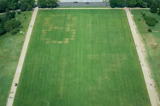 An aerial view of the National Mall with numbers traced into the lawn