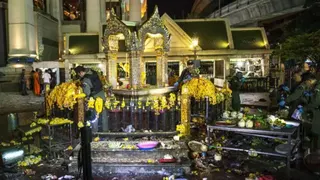 Reuters Thai police officers, investigators working at the shrine surrounded by debris and the remains of religious offerings of fruit and flowers, 17 Aug 2015