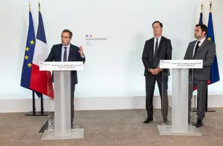 The three men stood at lecterns, Lecornu speaking, in front of France and EU flags