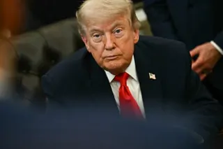 a man looks ahead while seated