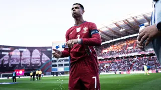 Cristiano Ronaldo drinks and splashes water during a soccer match at Estadio Dr. Magalhaes Pessoa in Leiria