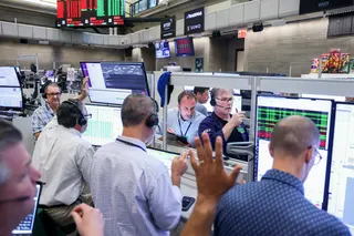 Traders work on the floor of the New York Stock Exchange.
