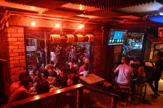 This photo taken on May 15, 2026 shows people having drinks and food outside a restaurant in Yangon. — AFP pic