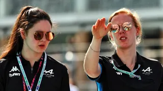 Abbi Pulling and Alice Powell in conversation while wearing Alpine polo shirts