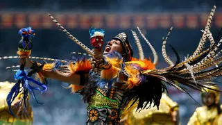 Performers during the opening ceremony before the match