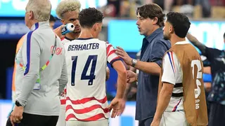 Mauricio Pochettino speaks to his players in the game against Paraguay