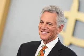 An older man smiles