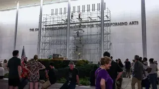Getty Images People mill about in front of scaffolding on the front of the Kennedy Center