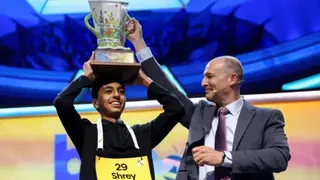 Shrey Parikh lifts the trophy after winning the annual Scripps National Spelling Bee.