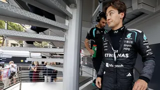 George Russell heads to the stewards' room during the red-flag period in Monaco