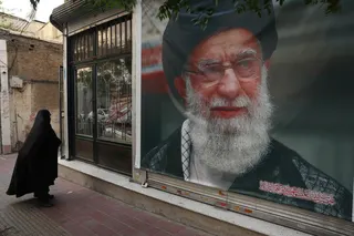 A woman walks past a banner with a picture of the late Iran’s Supreme Leader Ayatollah Ali Khamenei, on a street in Tehran June 7, 2026. — Majid Asgaripour/Wana (West Asia News Agency) pic via Reuters