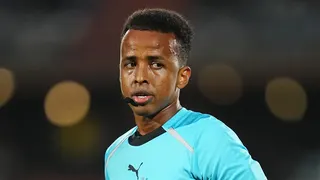 Omar Artan refereeing a match
