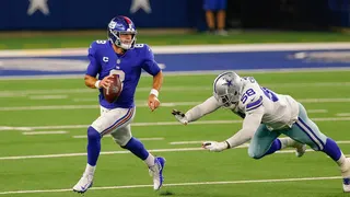 New York Giants quarterback Daniel Jones is chased by Dallas Cowboys linebacker Aldon Smith at AT&T Stadium.