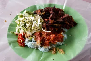 Nasi kerabu kambing bakar DUKE serves grilled lamb, beef and chicken as sides for ‘nasi kerabu’. — Picture by Soo Wern Jun