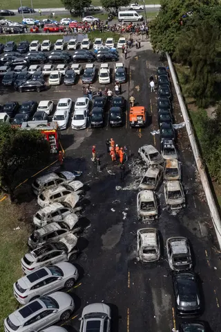 The helicopters fell into an electric car parking lot after colliding
