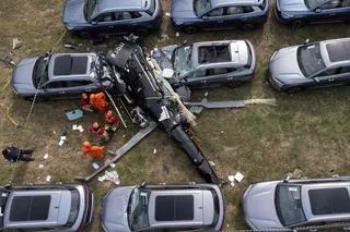 Firefighters at the site of a helicopter crash in the Recreio dos Bandeirantes neighbourhood of Rio de Janeiro, Brazil on Sunday. Photo: AFP